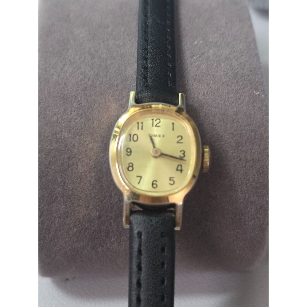 Vintage Timex Women's Gold-Tone Oval Dress Watch on Black Leather
